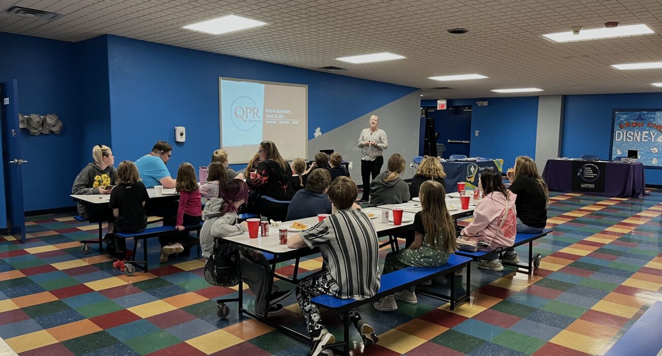 Classroom presentation in a large room with students and a TCHD staff person teaching.