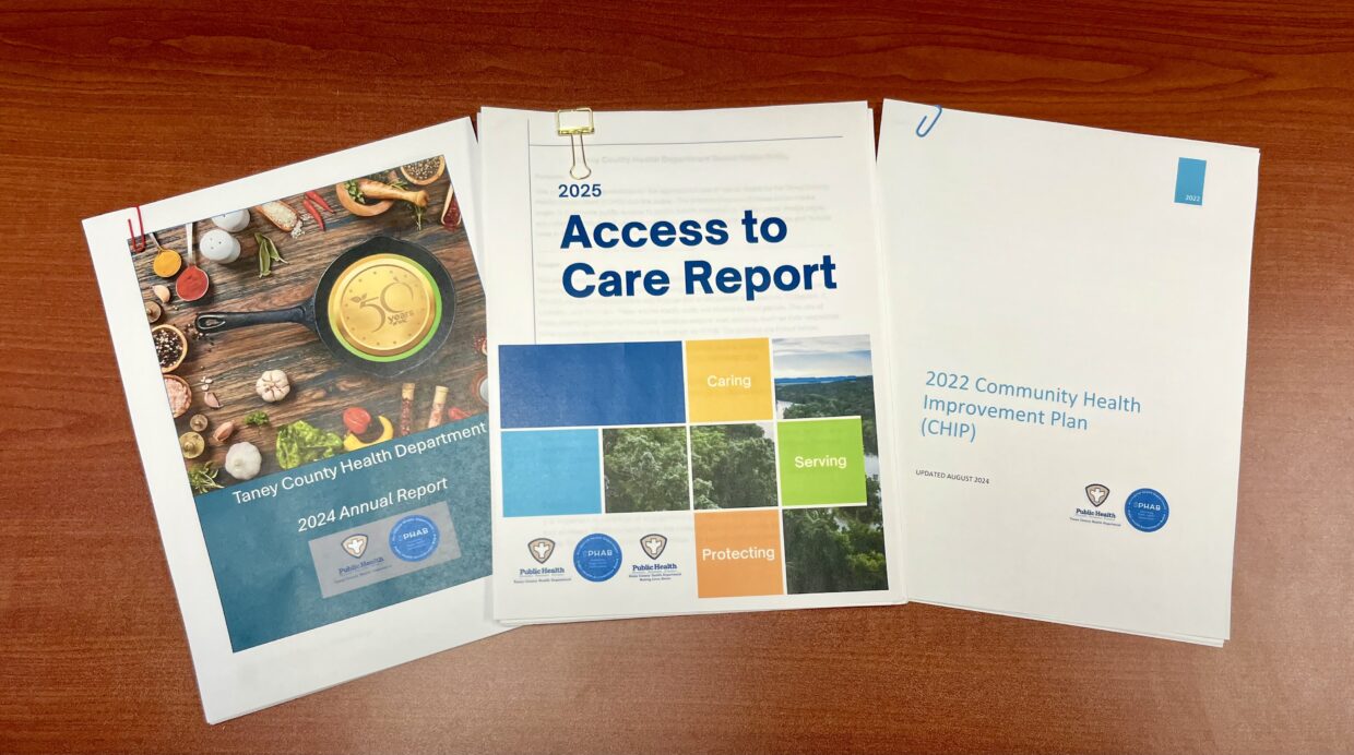 Paper copies of the 2024 Annual Report, 2025 Access to Care Report, and the 2022 Community Health Improvement Plan.