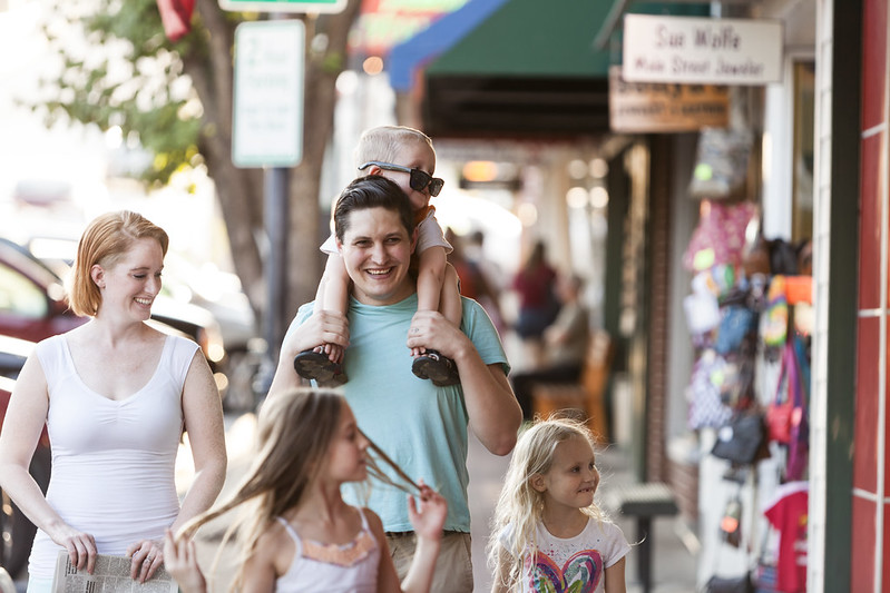 family walking in downtown Branson