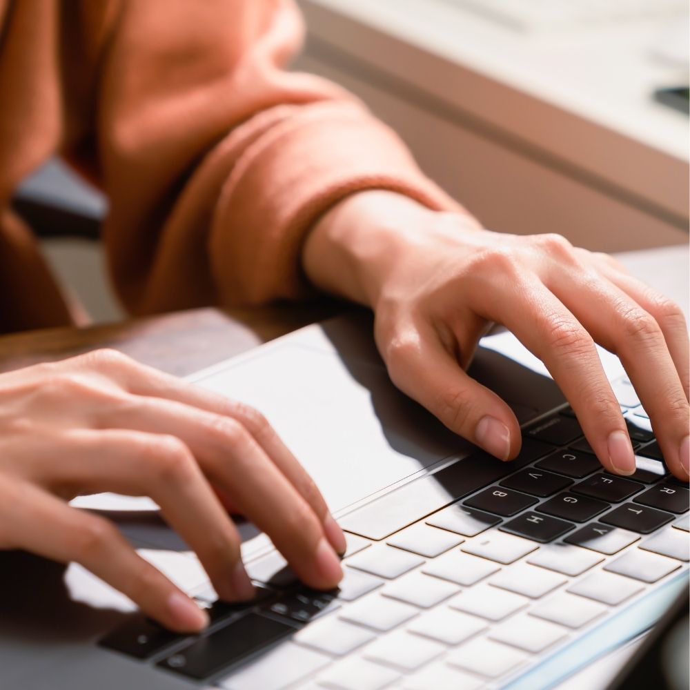 person typing on computer